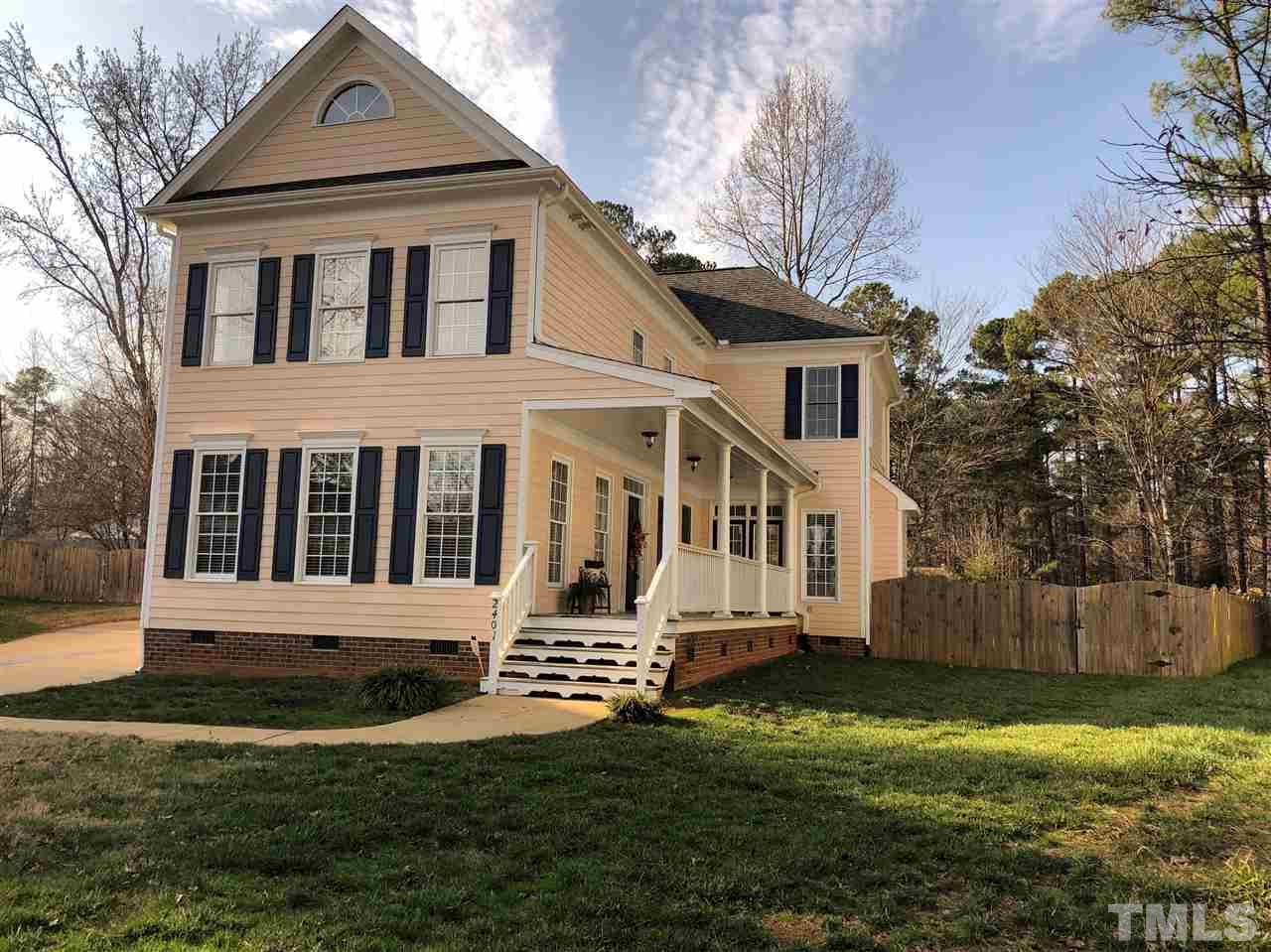 2401 Carruthers Court Raleigh, NC 27615 - Photo 2 of 25 a front view of a house with a yard