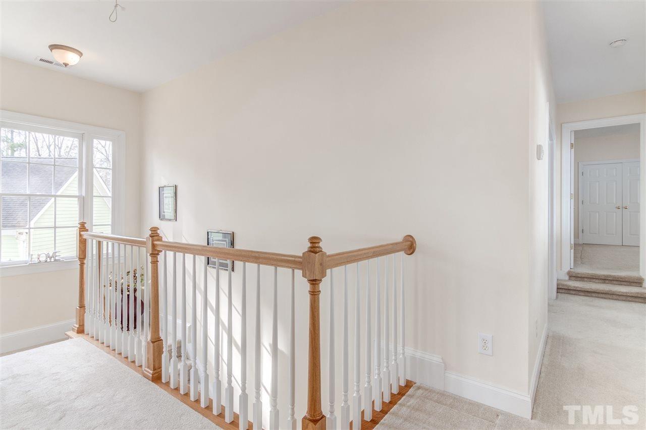 2401 Carruthers Court Raleigh, NC 27615 - Photo 20 of 25 a view of a hallway with a window