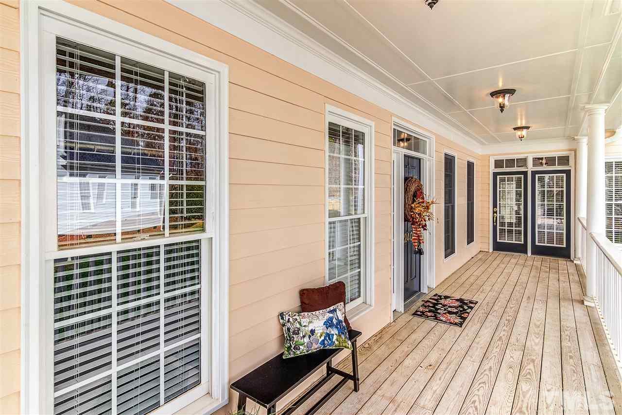 2401 Carruthers Court Raleigh, NC 27615 - Photo 3 of 25 a view of balcony with wooden floor and seating space