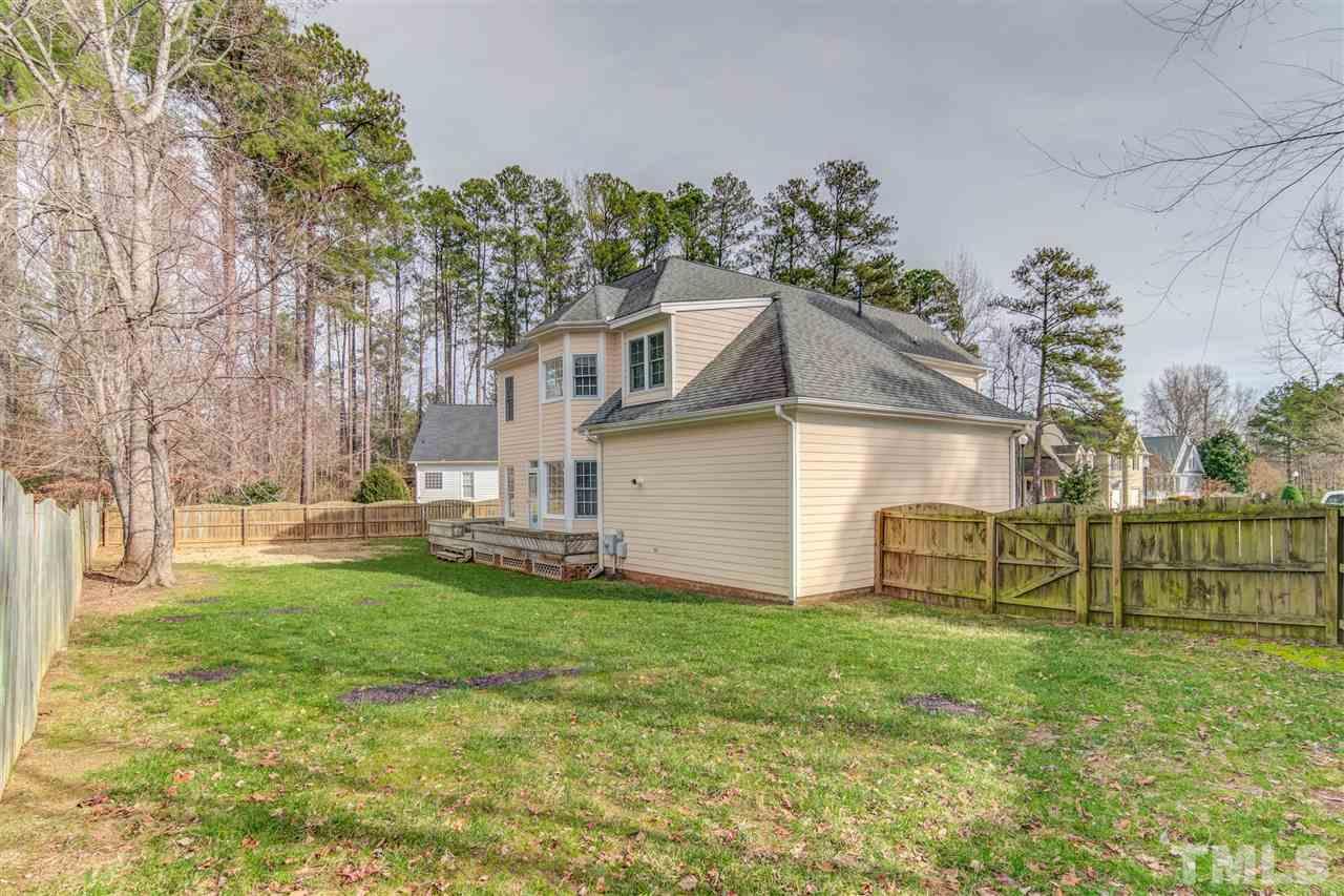 2401 Carruthers Court Raleigh, NC 27615 - Photo 23 of 25 a view of a house with a yard and a large tree