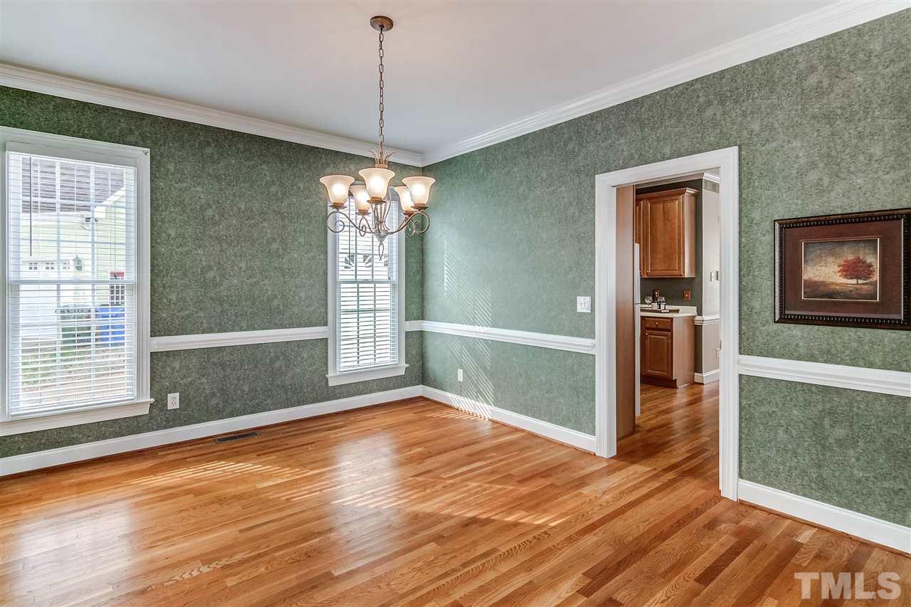 2401 Carruthers Court Raleigh, NC 27615 - Photo 5 of 25 a view of livingroom with hardwood floor and window