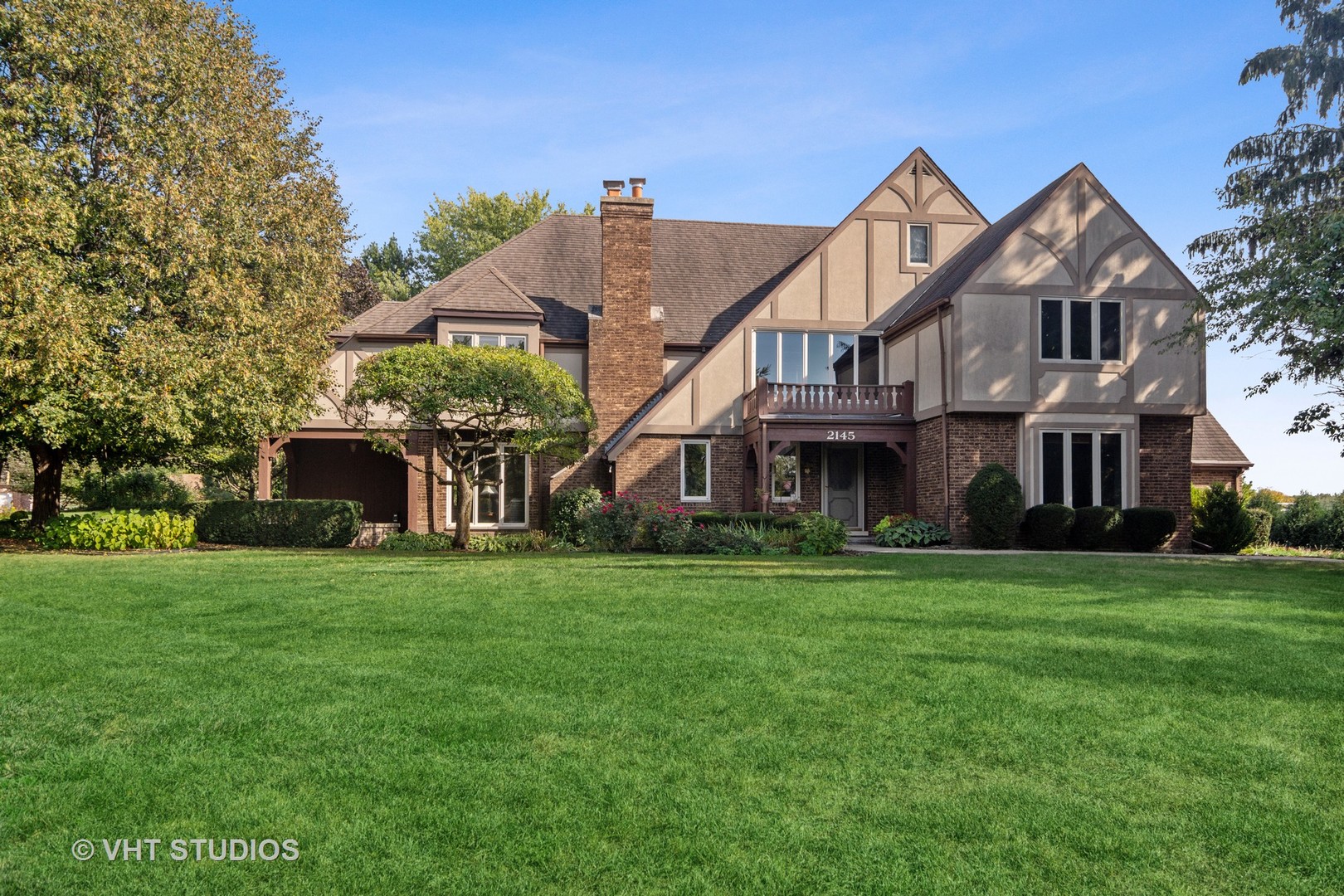 2145 Common Ridings Way Inverness, IL 60010 - Photo 1 of 1 a front view of a house with a garden