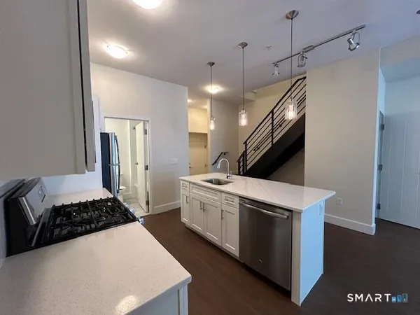 a kitchen with a stove and a refrigerator