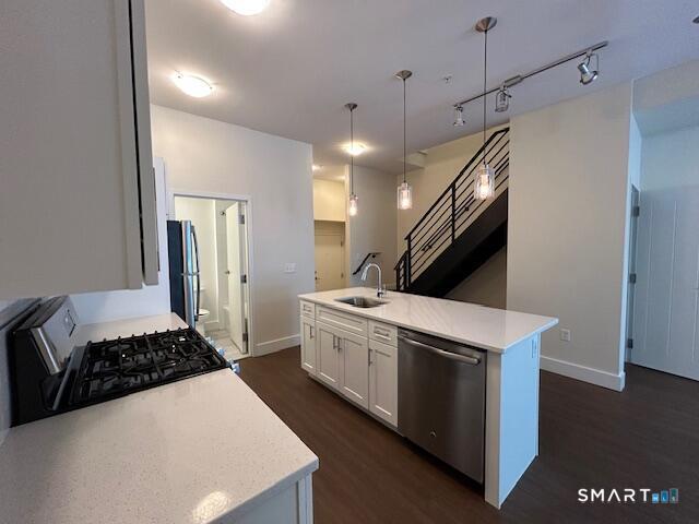 111 Morgan Street, Unit TH5 Stamford, CT 06905 - Photo 1 of 23 a kitchen with a stove and a refrigerator