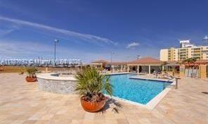90 Alton Road, Unit 1 Miami Beach, FL 33139 - Photo 27 of 36 a view of a swimming pool and a terrace