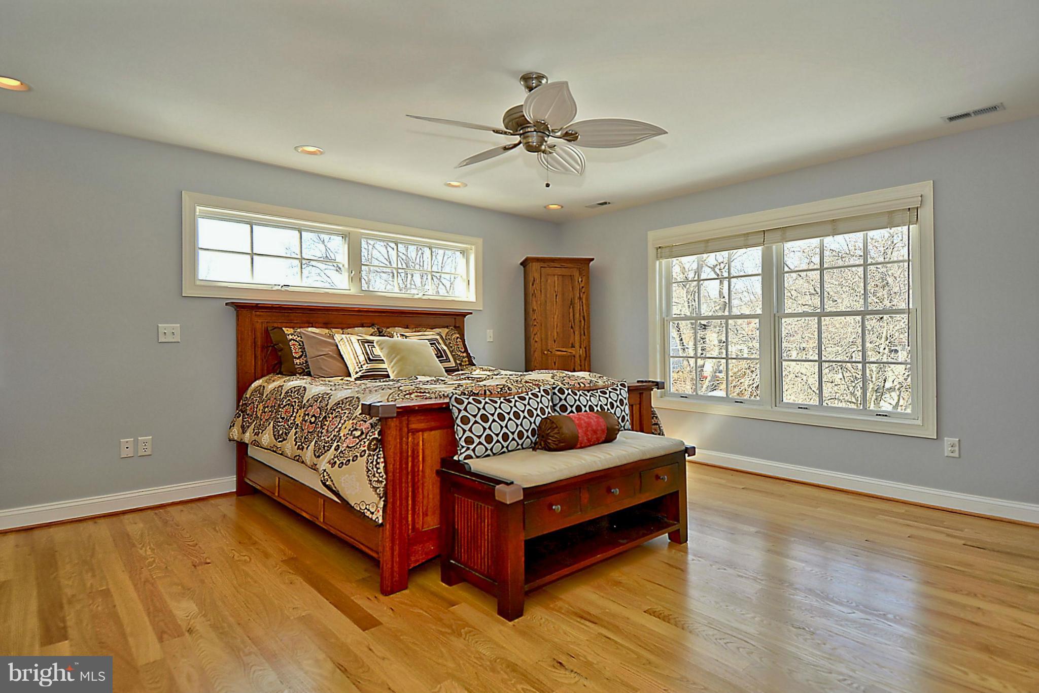 624 Truxton Road Annapolis, MD 21409 - Photo 16 of 30 a bedroom with a bed couch and windows