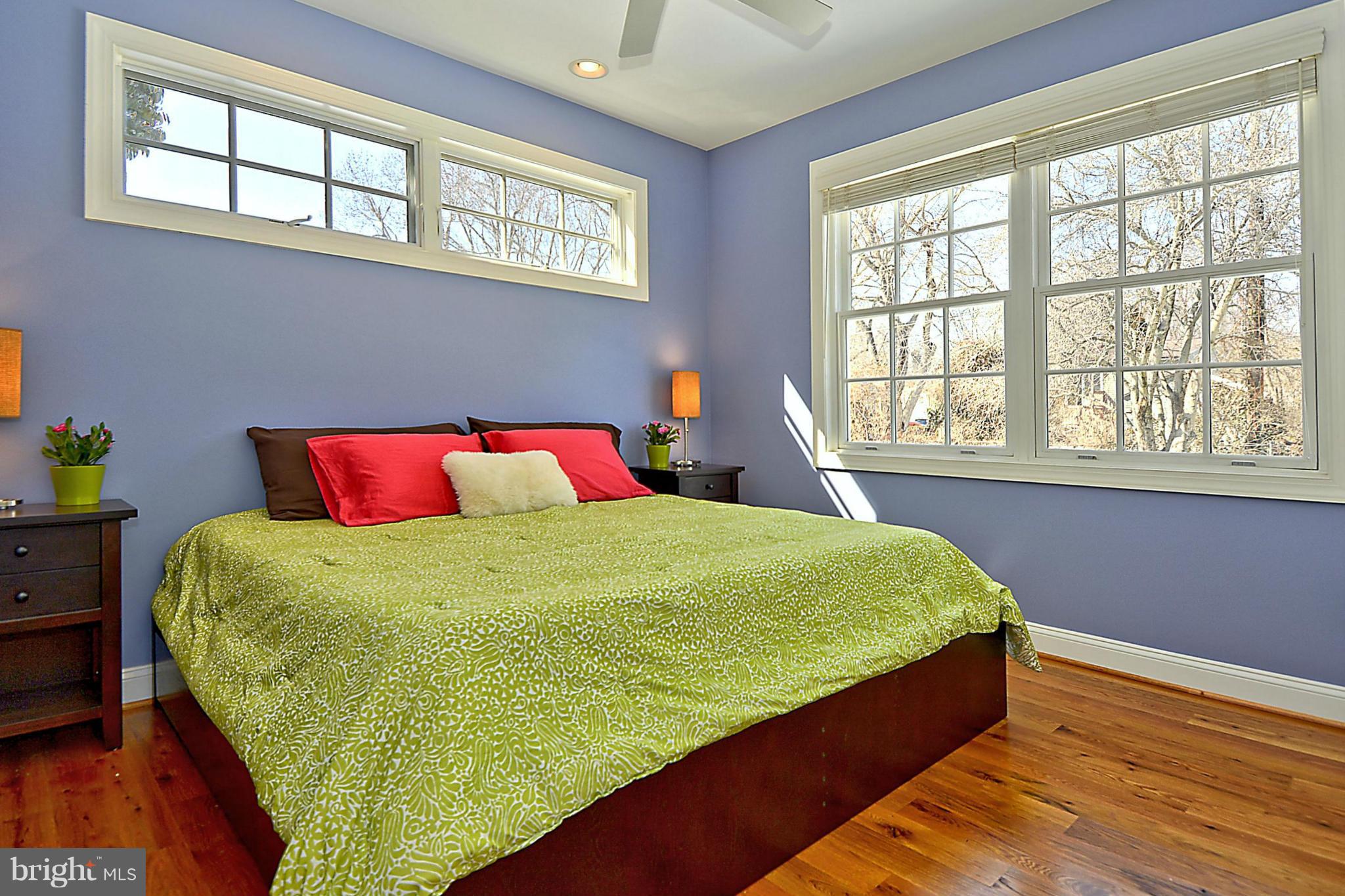 624 Truxton Road Annapolis, MD 21409 - Photo 21 of 30 a bed sitting in a bedroom next to a window