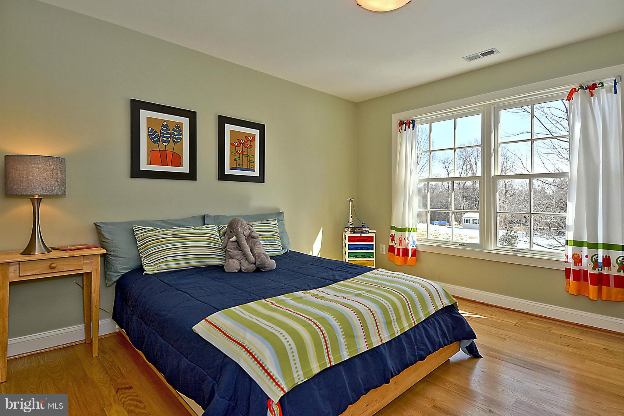 624 Truxton Road Annapolis, MD 21409 - Photo 25 of 30 a bedroom with a bed and wooden floor