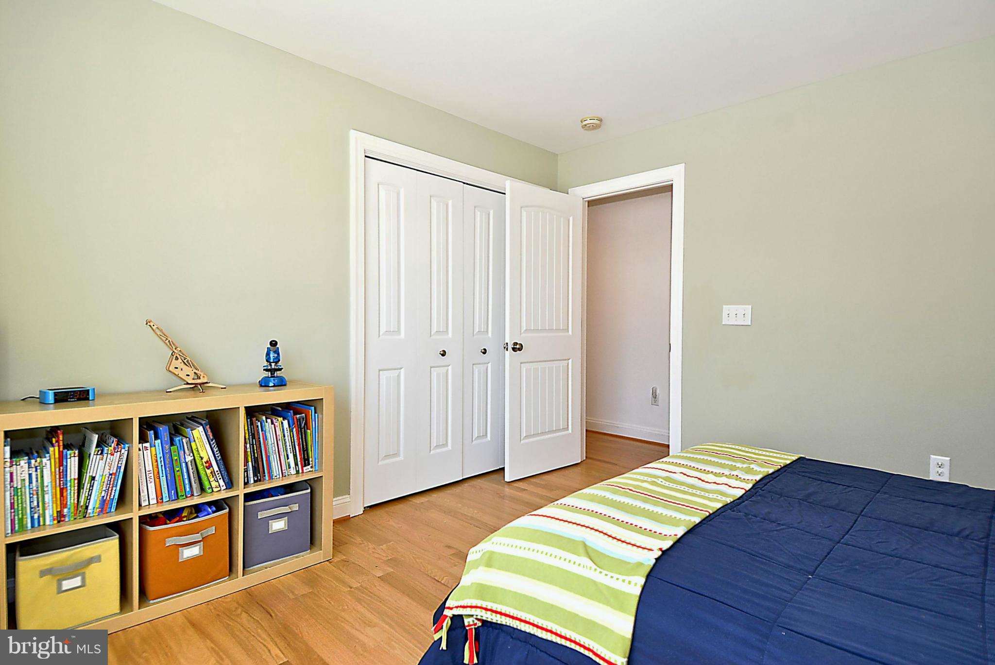 624 Truxton Road Annapolis, MD 21409 - Photo 26 of 30 a bedroom with a bed and a book shelf