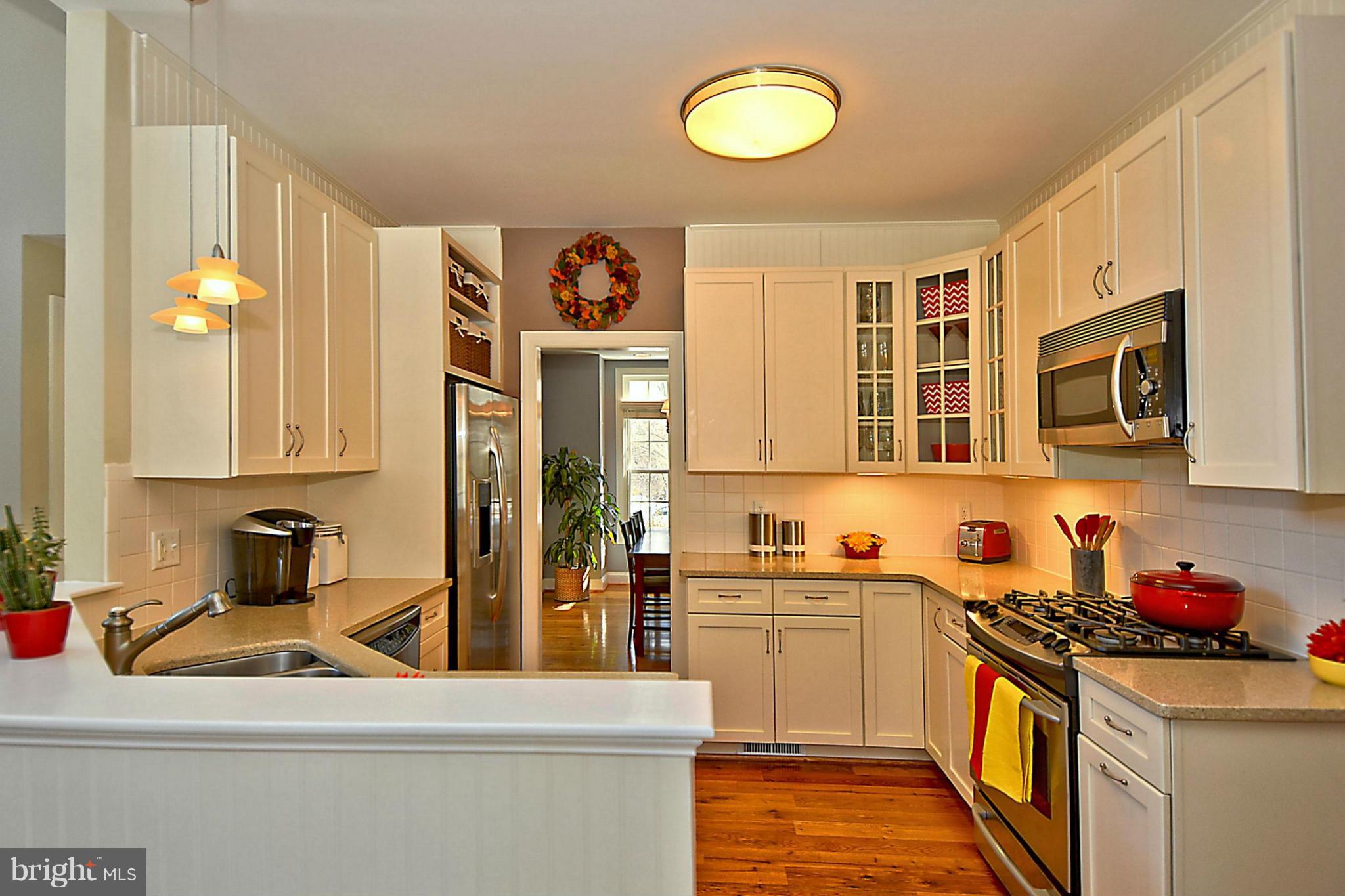 624 Truxton Road Annapolis, MD 21409 - Photo 7 of 30 a kitchen that has a sink and a stove