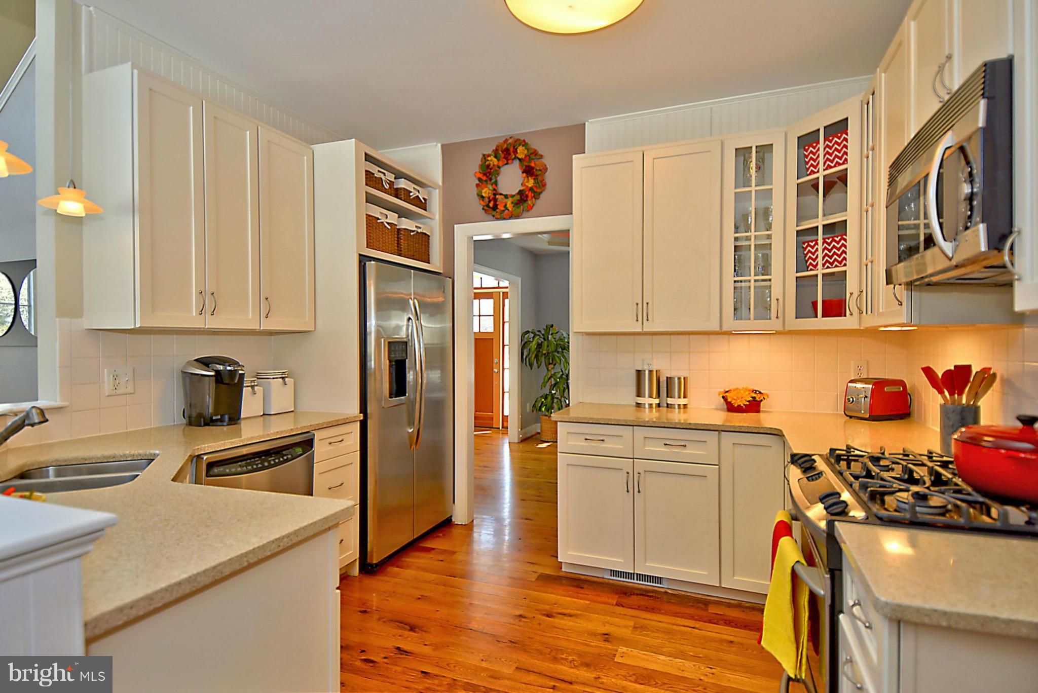 624 Truxton Road Annapolis, MD 21409 - Photo 8 of 30 a kitchen with stainless steel appliances granite countertop a sink stove and refrigerator