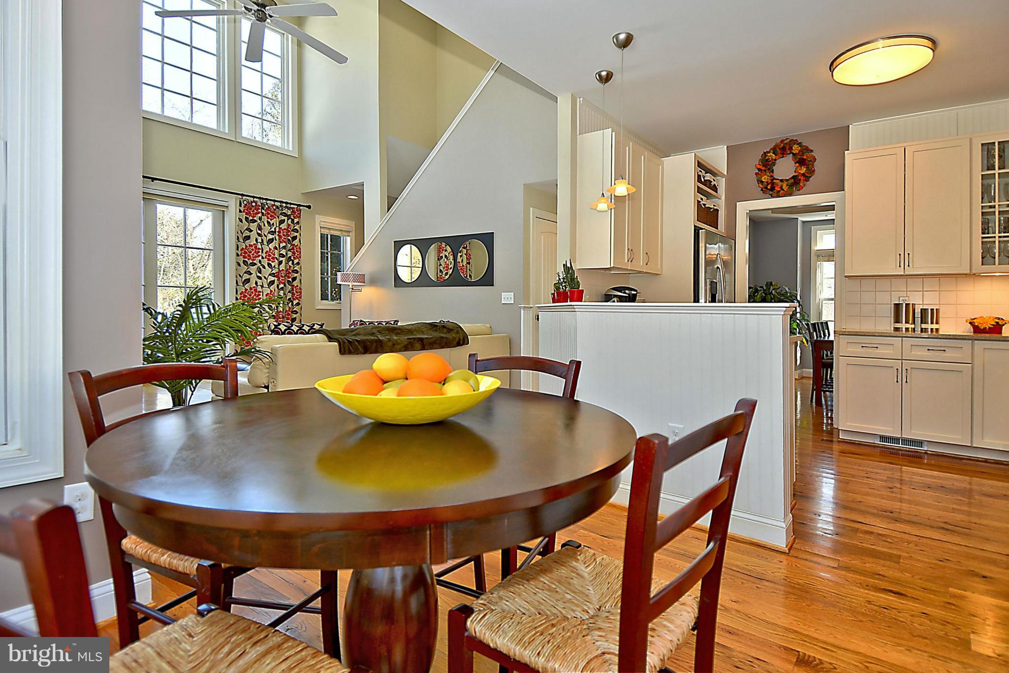 624 Truxton Road Annapolis, MD 21409 - Photo 10 of 30 a view of a dining room with furniture and wooden floor