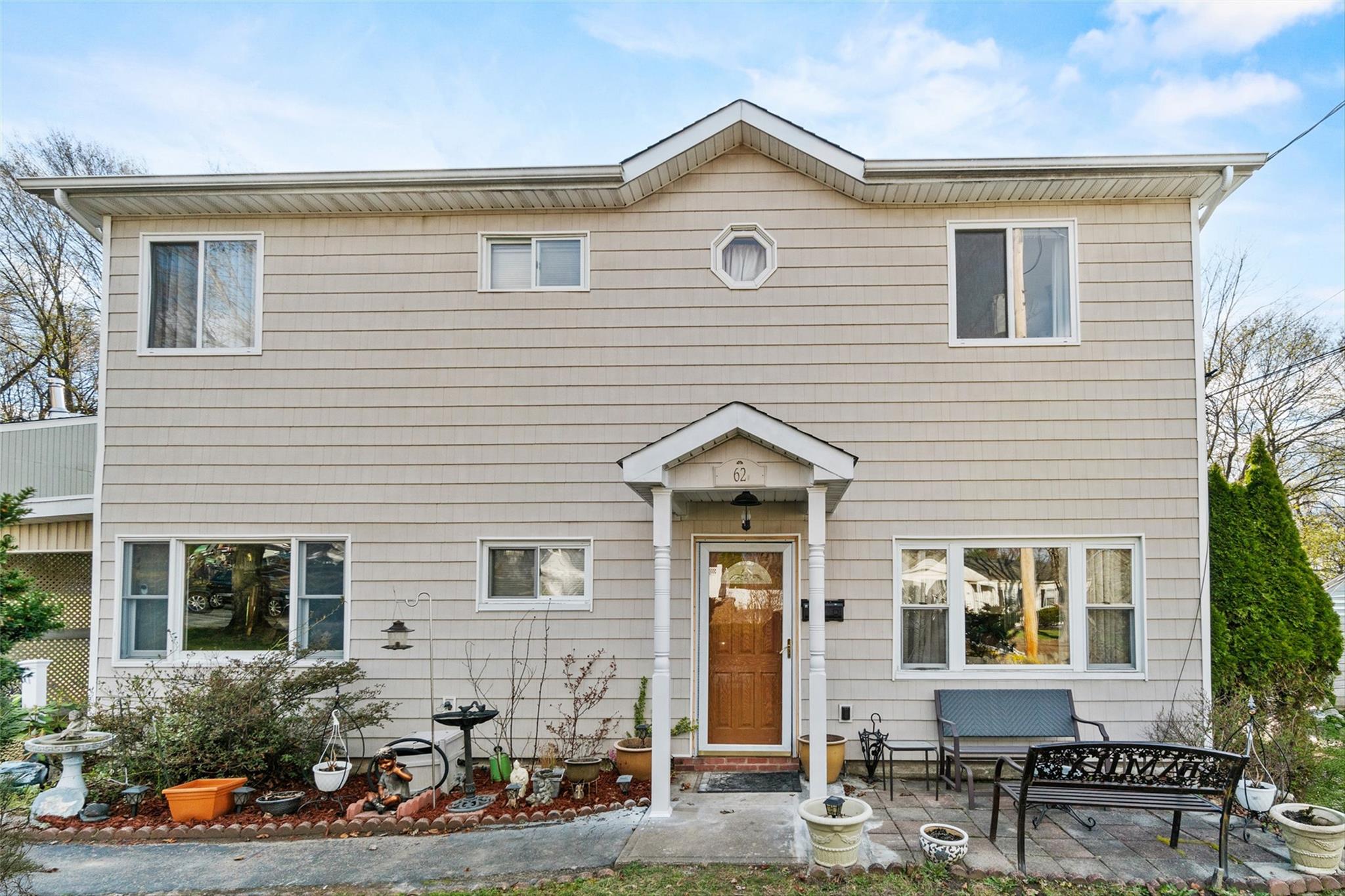 62 Cayuga Drive Peekskill, NY 10566 - Photo 1 of 24 a front view of a house with patio