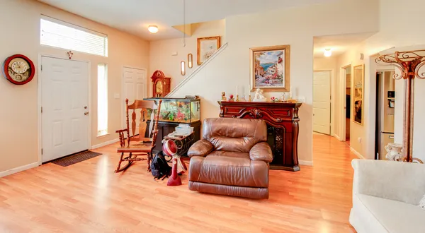 a living room with furniture and a large window
