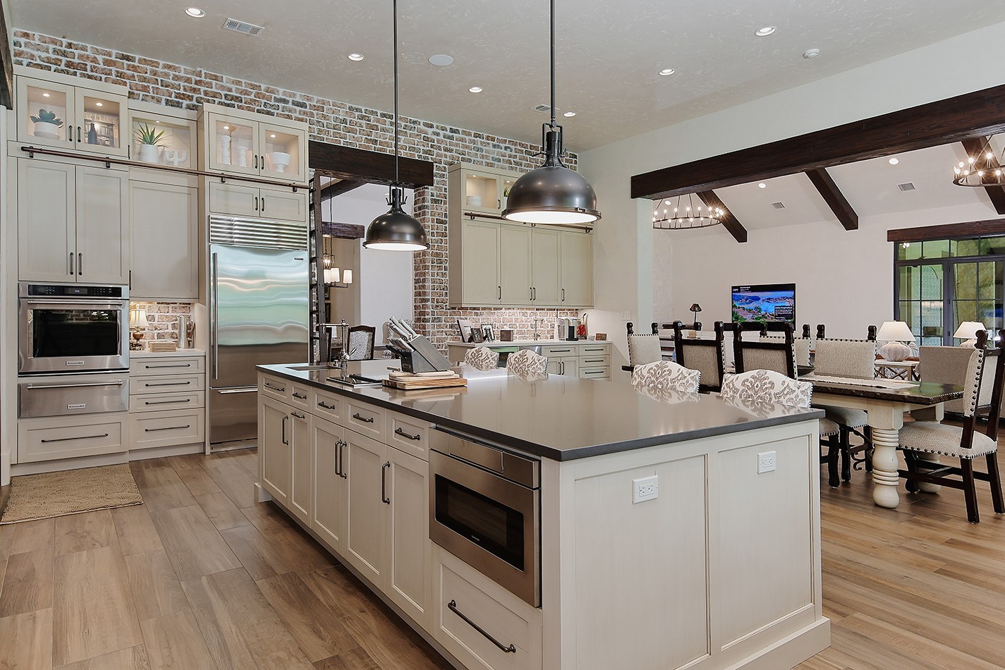 40693 Center Hill Road Hempstead, TX 77445 - Photo 25 of 50 a kitchen with stainless steel appliances kitchen island granite countertop a sink and a refrigerator