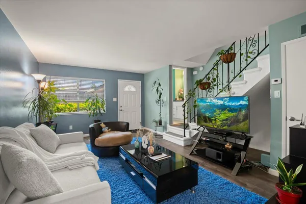 a living room with furniture and a flat screen tv