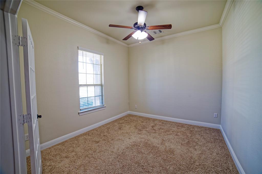 10929 Calvert Place McKinney, TX 75071 - Photo 11 of 39 an empty room with a window and a fan