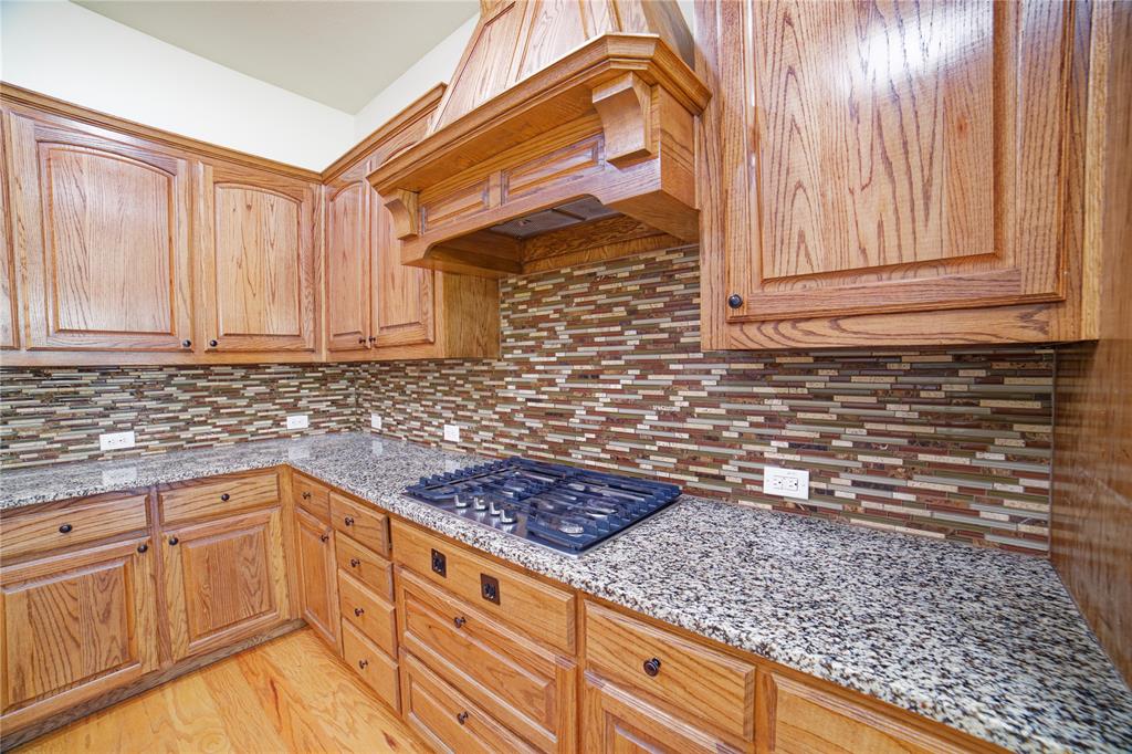 10929 Calvert Place McKinney, TX 75071 - Photo 17 of 39 a kitchen with stainless steel appliances granite countertop a sink and cabinets