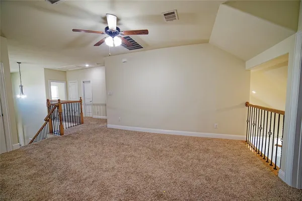 a view of a hallway with windows