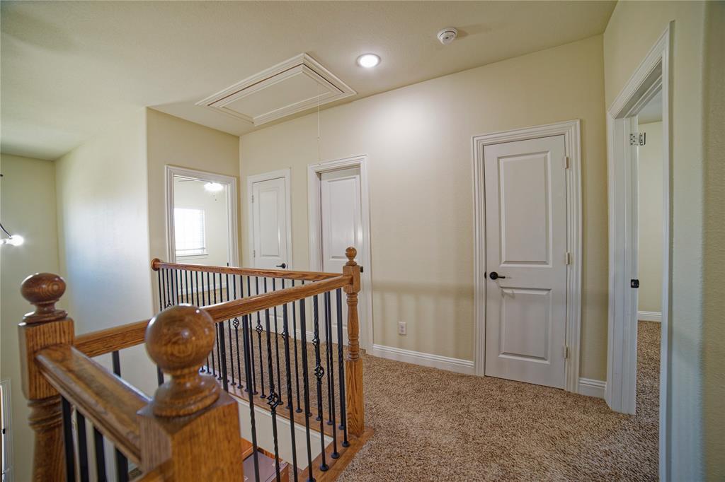 10929 Calvert Place McKinney, TX 75071 - Photo 32 of 39 a view of a hallway with windows
