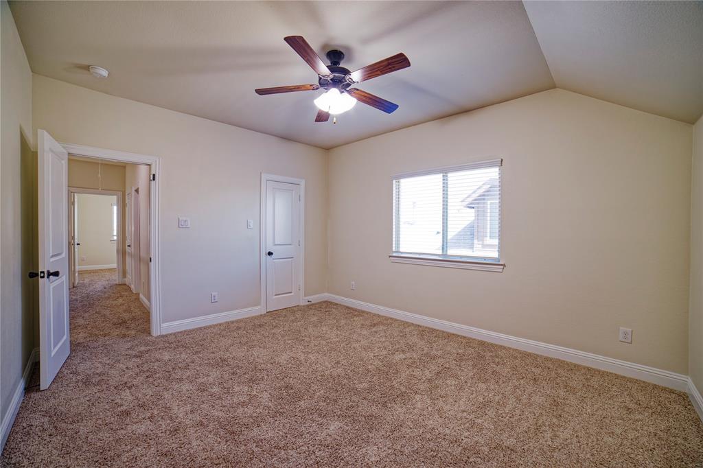 10929 Calvert Place McKinney, TX 75071 - Photo 33 of 39 an empty room with closet and windows