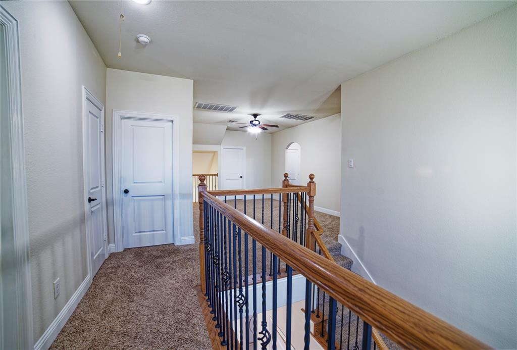 10929 Calvert Place McKinney, TX 75071 - Photo 38 of 39 a view of a hallway view with staircase
