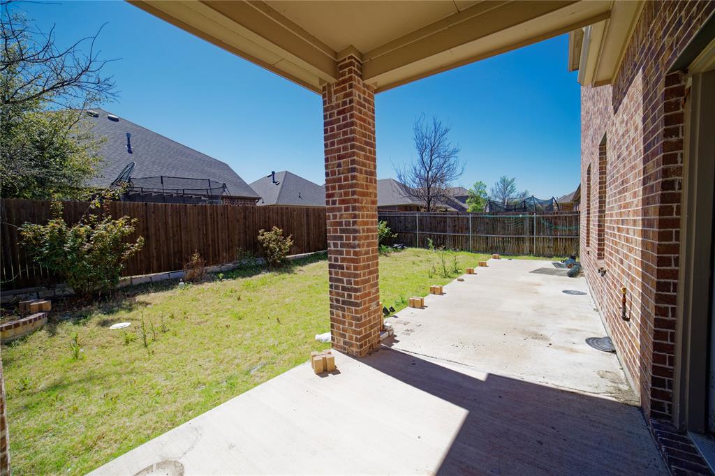 10929 Calvert Place McKinney, TX 75071 - Photo 39 of 39 a view of a backyard with plants