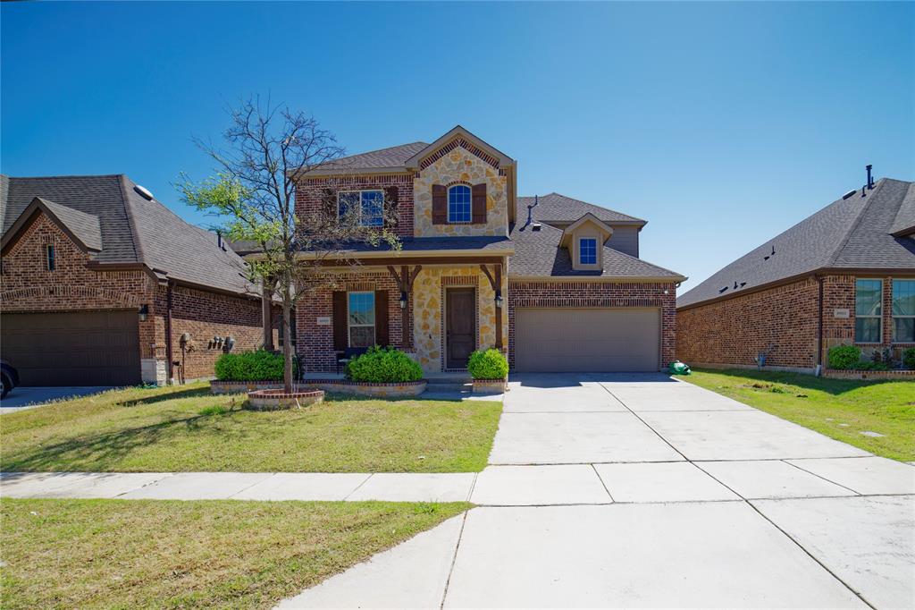 10929 Calvert Place McKinney, TX 75071 - Photo 5 of 39 a front view of a house with a yard and garage