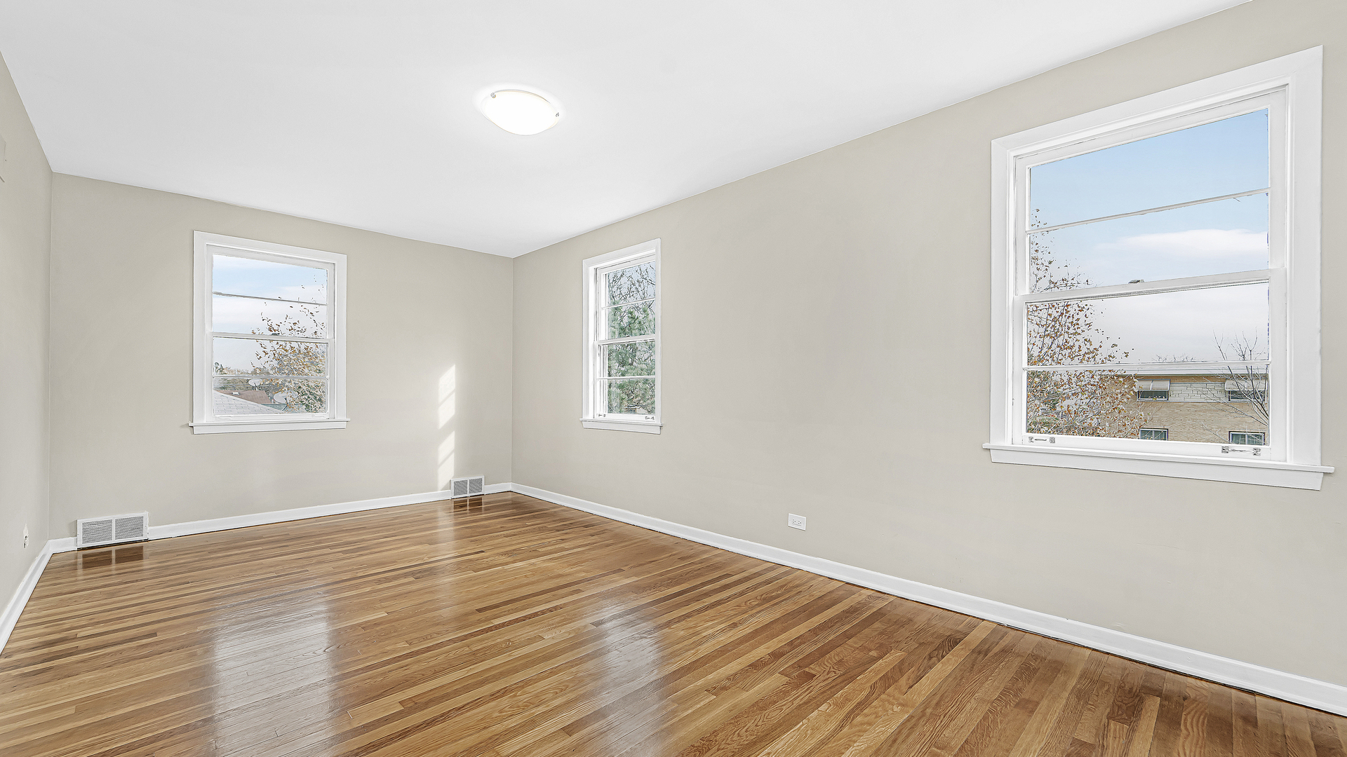 1314 Pitner Avenue Evanston, IL 60201 - Photo 12 of 19 a view of empty room with wooden floor and fan