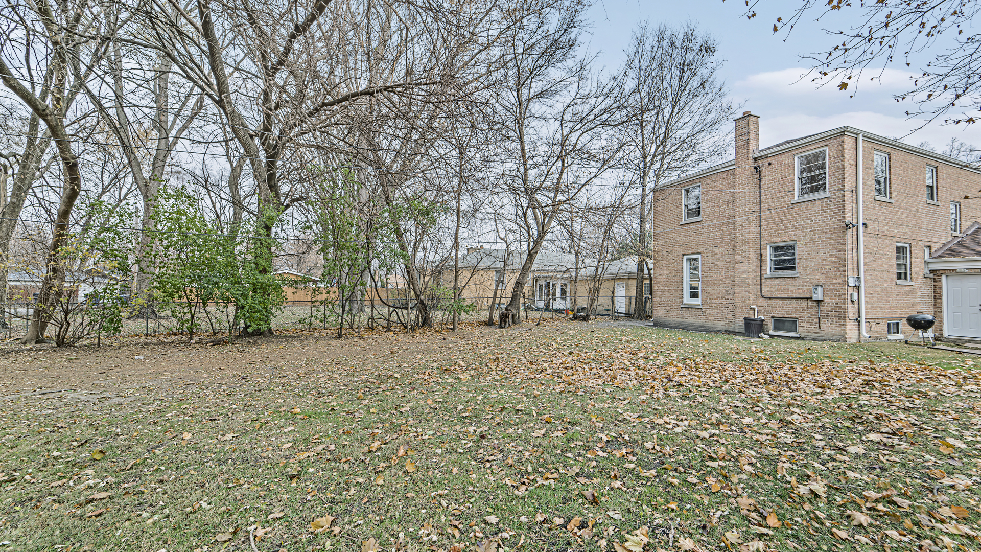 1314 Pitner Avenue Evanston, IL 60201 - Photo 15 of 19 a backyard of a house with large trees