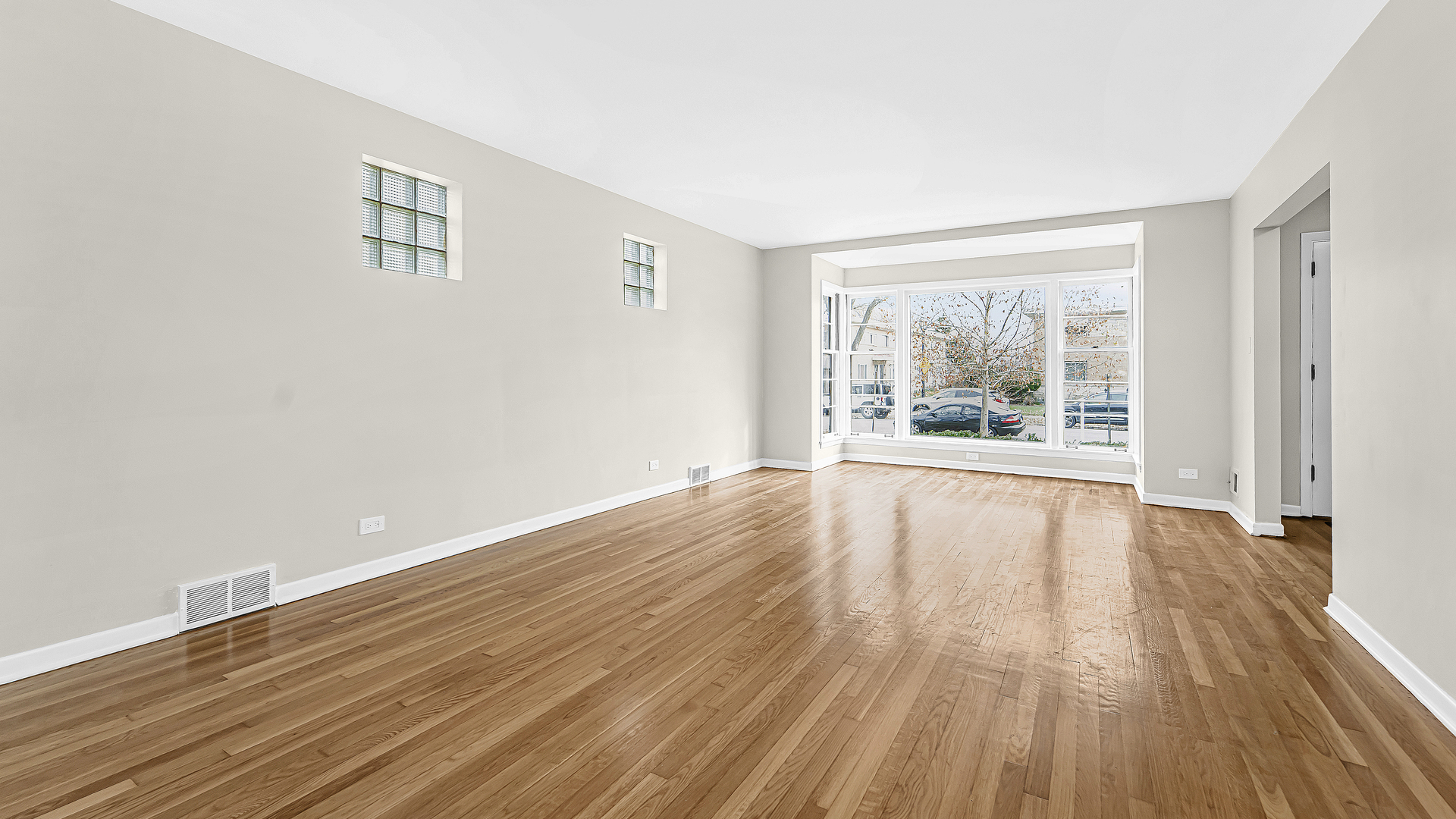 1314 Pitner Avenue Evanston, IL 60201 - Photo 4 of 19 wooden floor in an empty room with a window