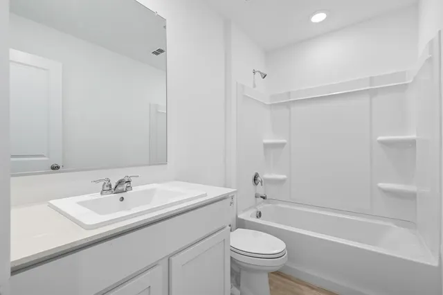 a bathroom with a sink toilet and a bathtub
