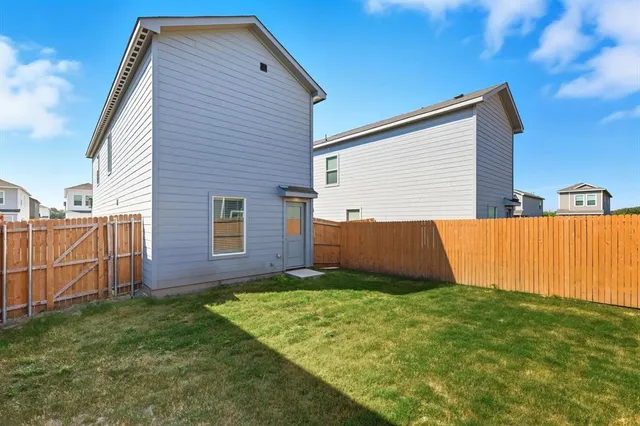 a view of backyard with small cabin