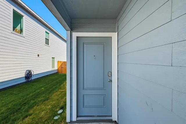 a view of a backyard of the house