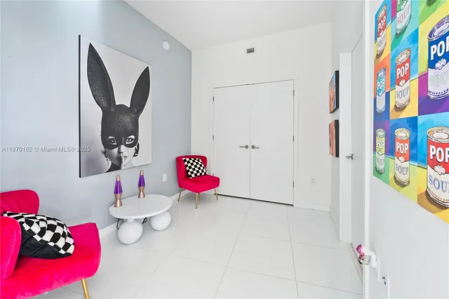 a bathroom with a sink vanity mirror and toilet