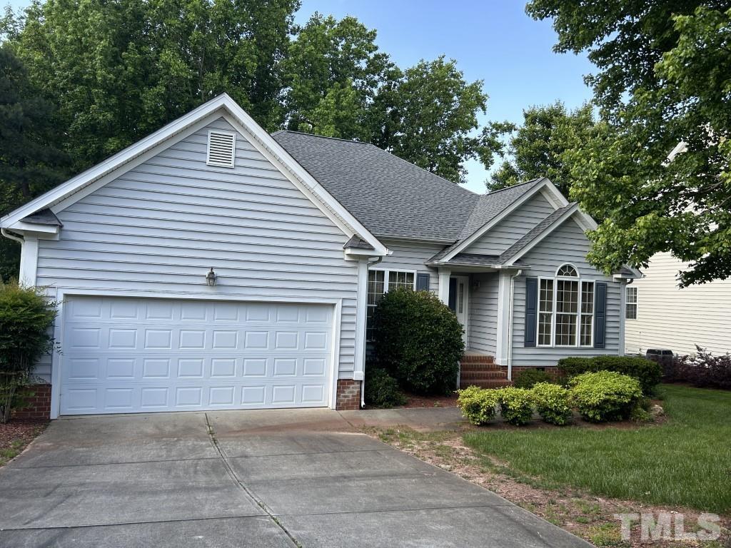 9904 Wyngate Ridge Drive Raleigh, NC 27617 - Photo 1 of 39 a view of a house with a yard