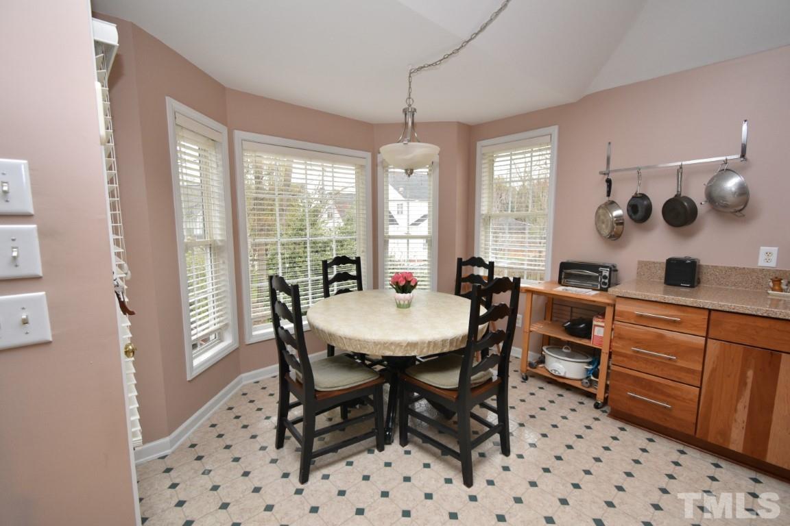 9904 Wyngate Ridge Drive Raleigh, NC 27617 - Photo 19 of 39 a view of a dining room with furniture window and outside view