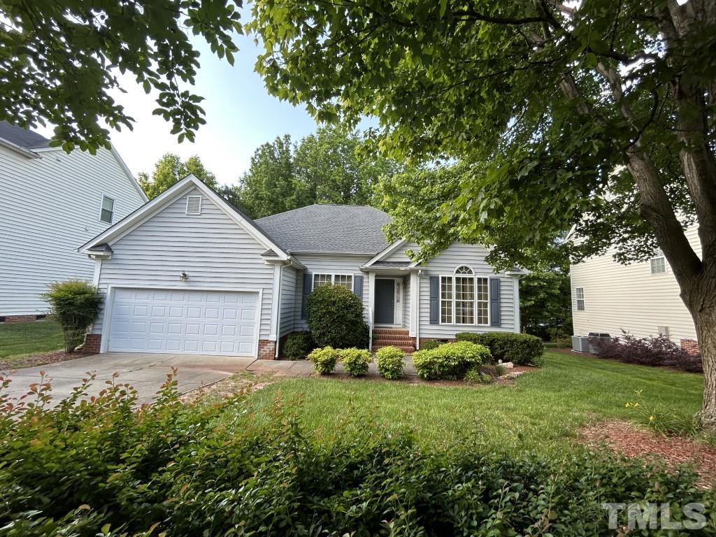 9904 Wyngate Ridge Drive Raleigh, NC 27617 - Photo 2 of 39 a front view of house with yard and green space