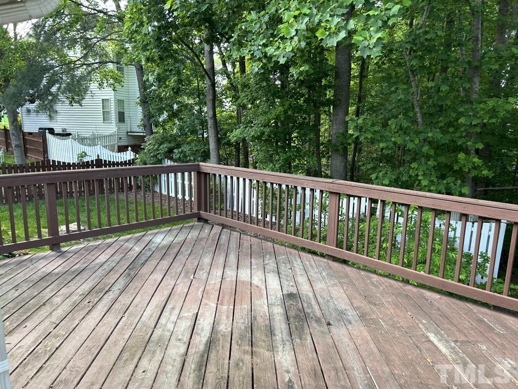 9904 Wyngate Ridge Drive Raleigh, NC 27617 - Photo 38 of 39 a view of balcony with wooden floor and fence