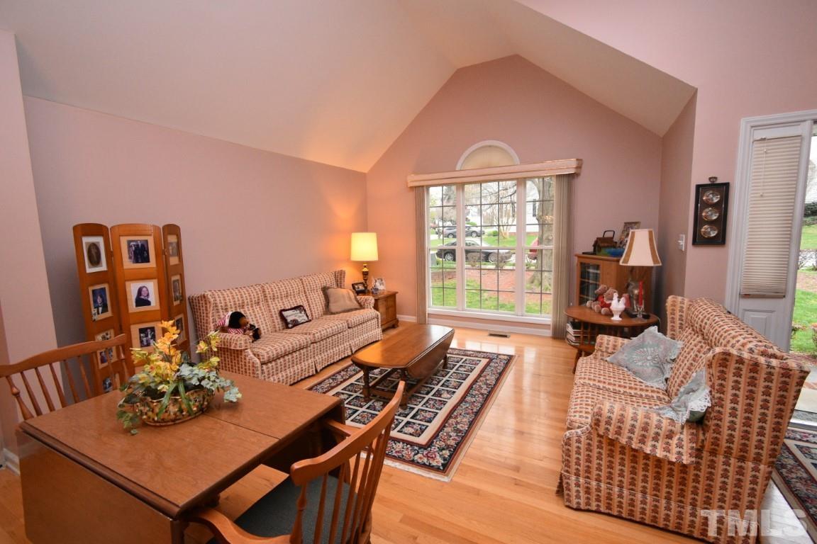 9904 Wyngate Ridge Drive Raleigh, NC 27617 - Photo 5 of 39 a living room with furniture and wooden floor