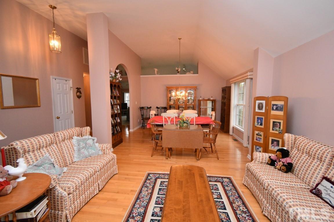 9904 Wyngate Ridge Drive Raleigh, NC 27617 - Photo 6 of 39 a living room with furniture and a couch