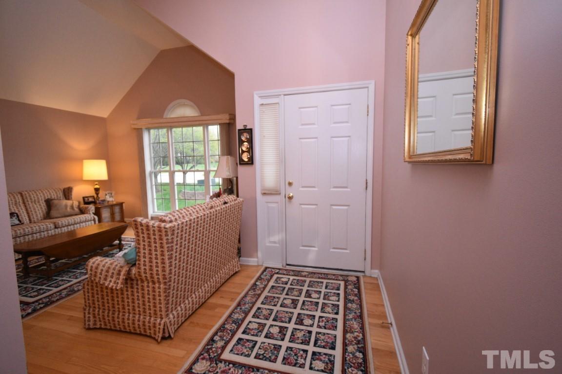 9904 Wyngate Ridge Drive Raleigh, NC 27617 - Photo 7 of 39 a bedroom with a bed and window
