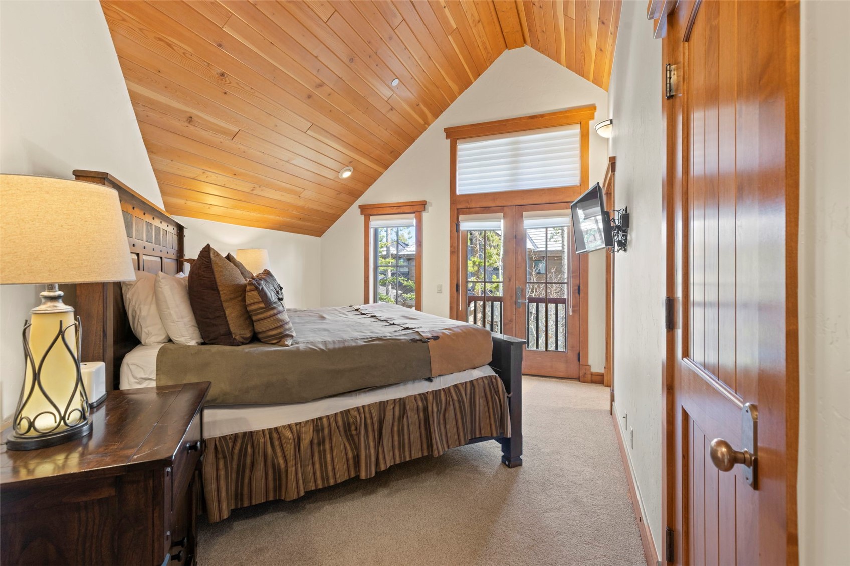 317 Timbertrail Road Breckenridge, CO 80424 - Photo 37 of 50 a bed sitting in a bedroom next to a window