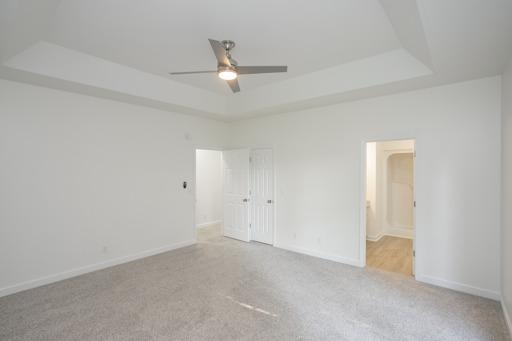 103 MacIntosh Drive Springfield, TN 37172 - Photo 11 of 20 an empty room with a ceiling fan and carpet