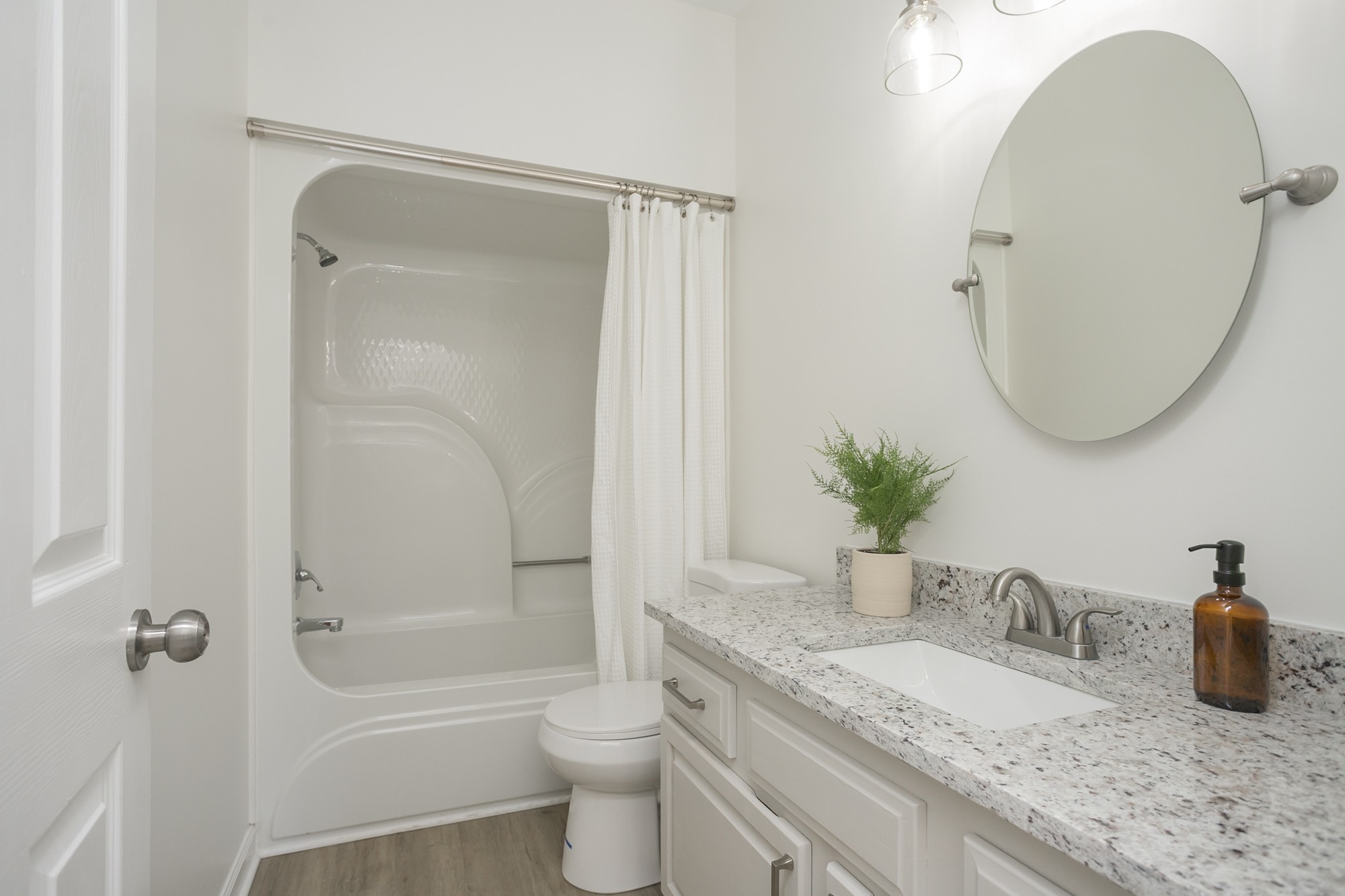 103 MacIntosh Drive Springfield, TN 37172 - Photo 17 of 20 a bathroom with a granite countertop sink a toilet and shower