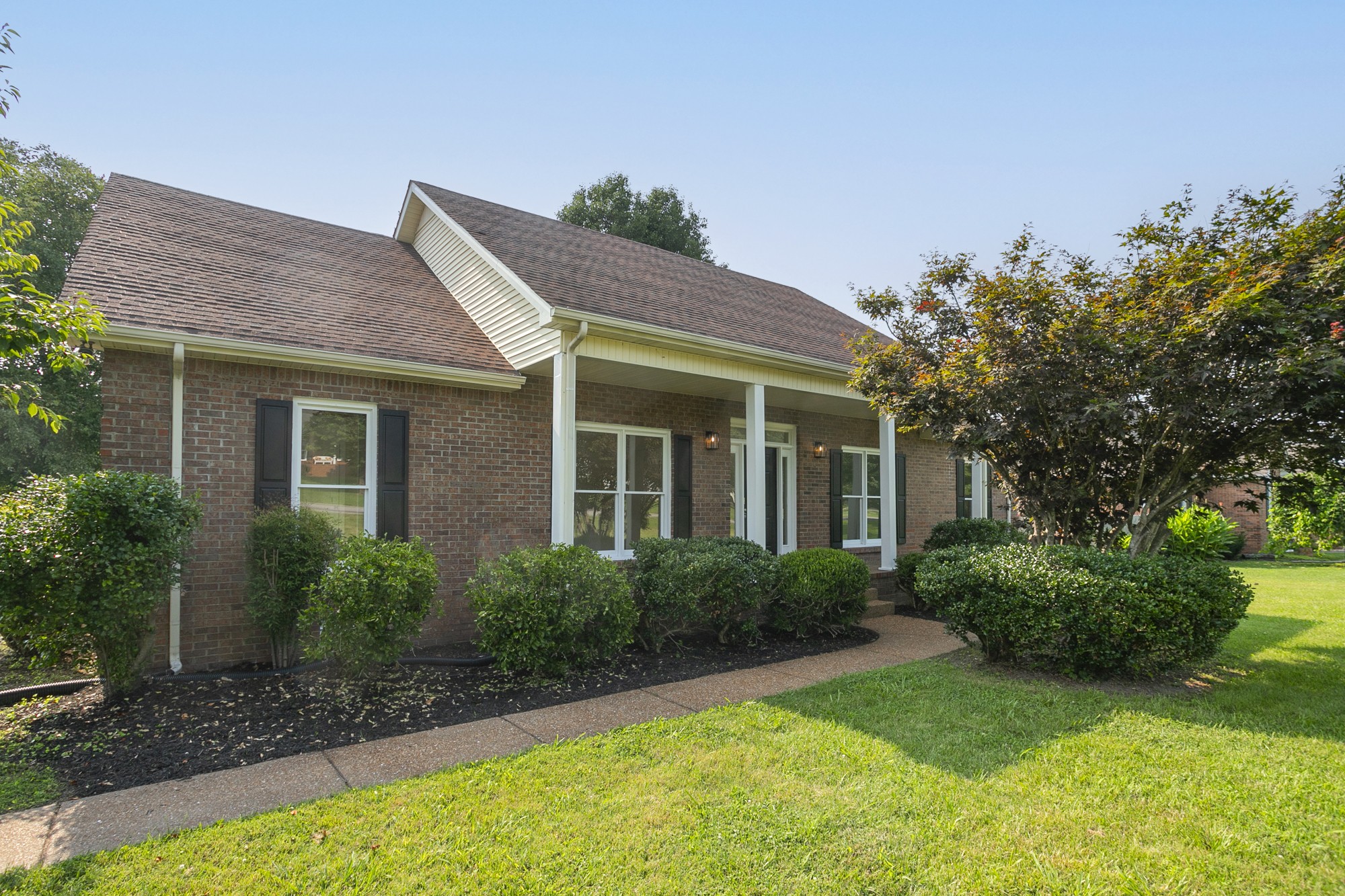 103 MacIntosh Drive Springfield, TN 37172 - Photo 2 of 20 a front view of a house with garden