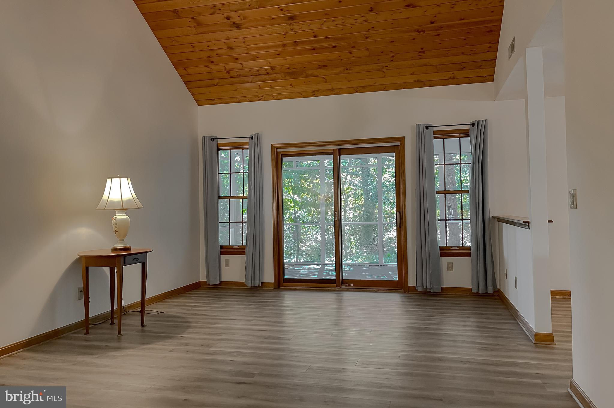 44059 Fieldstone Way California, MD 20619 - Photo 13 of 42 a view of an empty room with window and wooden floor