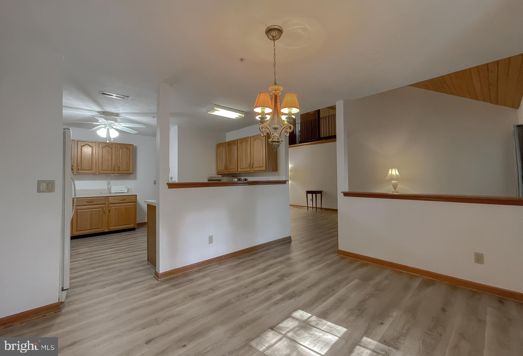 44059 Fieldstone Way California, MD 20619 - Photo 16 of 42 a view of a kitchen and a sink wooden floor kitchen view