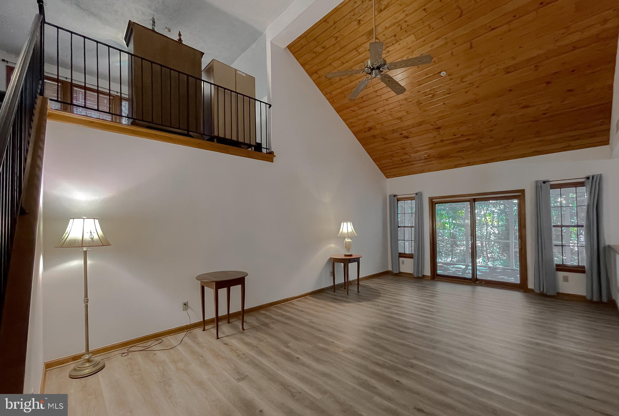 44059 Fieldstone Way California, MD 20619 - Photo 2 of 42 a view of an empty room with window and wooden floor