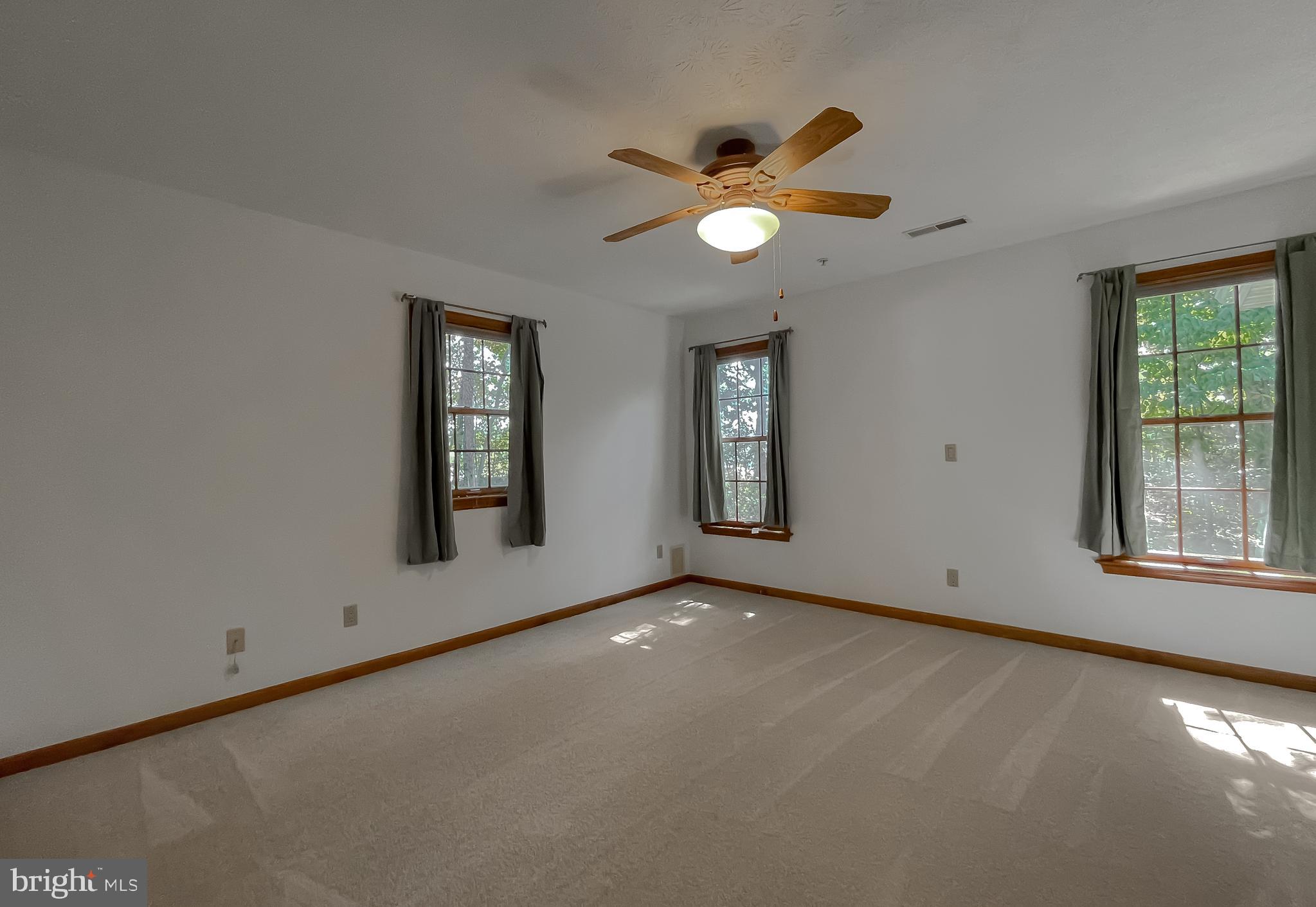 44059 Fieldstone Way California, MD 20619 - Photo 27 of 42 an empty room with windows and closet